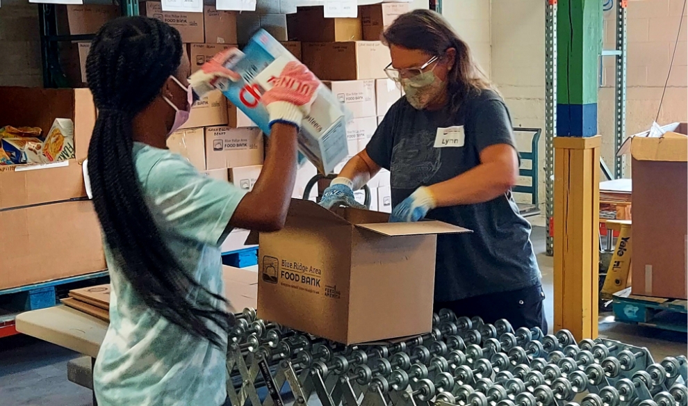 volunteers of Blue Ridge Area Food Bank packing boxes of food
