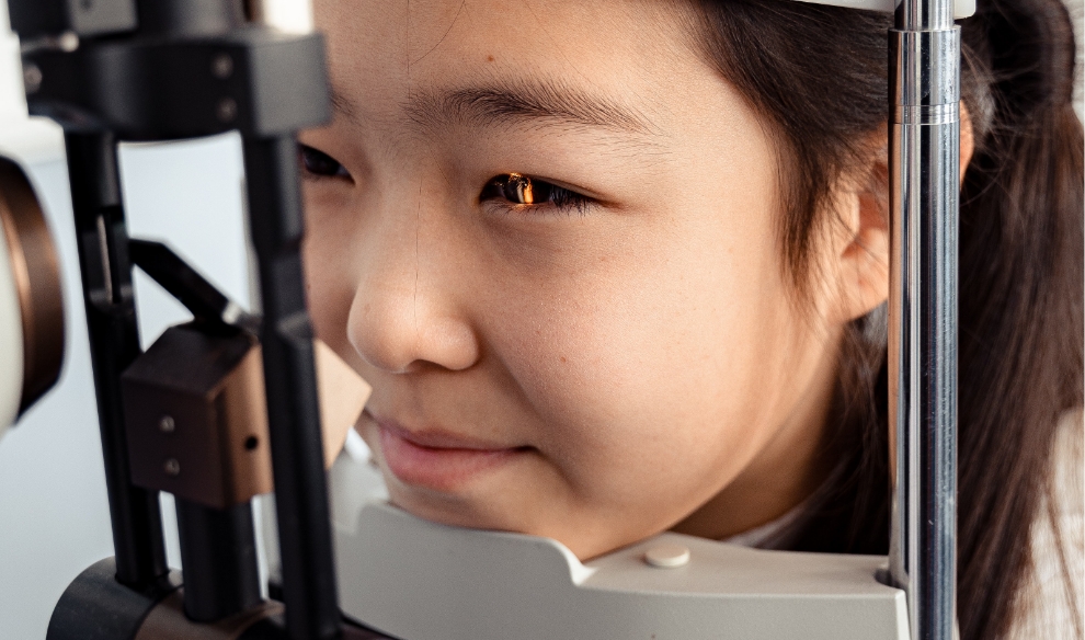 girl receiving vision exam