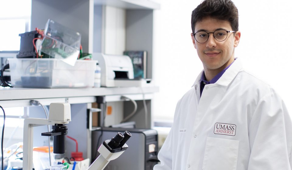 scientist in a laboratory with a microscope